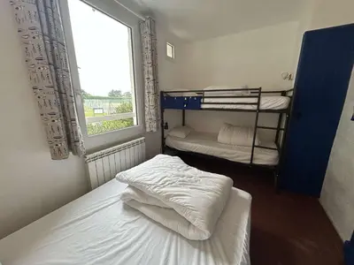 Un ou plusieurs lits dans un hébergement de l'établissement Maison familiale lumineuse, près de la plage, parking inclus - FR-1-224B-251