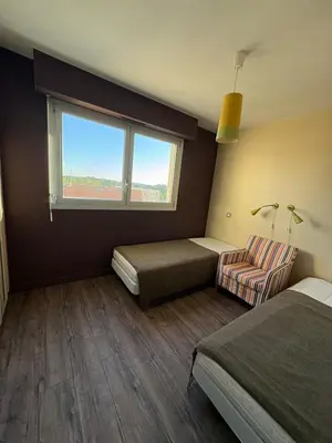 Un ou plusieurs lits dans un hébergement de l'établissement Bel appartement front de mer