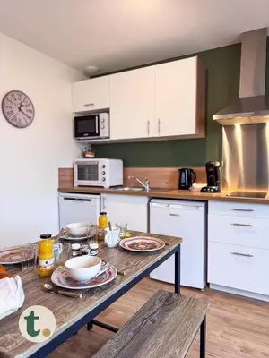Cuisine ou kitchenette dans l'établissement Tranquiloue - Appart tendance 18min du Puy du Fou
