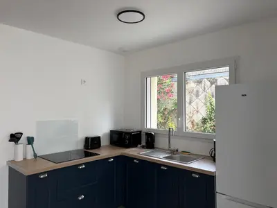 Cuisine ou kitchenette dans l'établissement Maison de ville St Nazaire