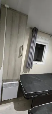 Un ou plusieurs lits dans un hébergement de l'établissement Mobil-Home Le Bois Dormant 87