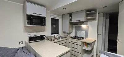 Télévision ou salle de divertissement dans l'établissement Mobil-Home Le Bois Dormant 87