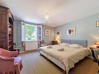 Un ou plusieurs lits dans un hébergement de l'établissement Maison de charme, Grand jardin, 3km plages, WiFi