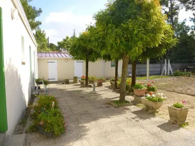 Jardin de l'établissement SJ000-005 - Maison 3 pièces 4 couchages - SAINT JEAN DE MONTS