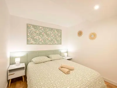 Un ou plusieurs lits dans un hébergement de l'établissement Atelier du Tisserand - Maison de caractère et calme