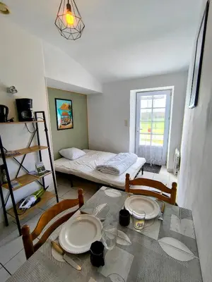 Un ou plusieurs lits dans un hébergement de l'établissement L' Appartement