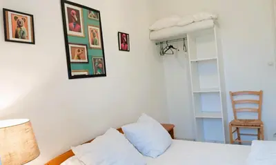 Un ou plusieurs lits dans un hébergement de l'établissement L' Appartement