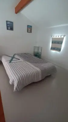 Un ou plusieurs lits dans un hébergement de l'établissement La maison du lac