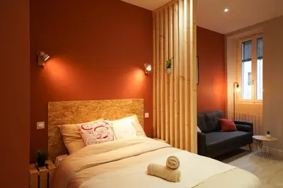 Un ou plusieurs lits dans un hébergement de l'établissement Studio Cosy, cœur de ville - Hyper Centre