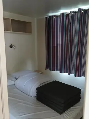 Un ou plusieurs lits dans un hébergement de l'établissement Mon petit Paradis - Kabana Village