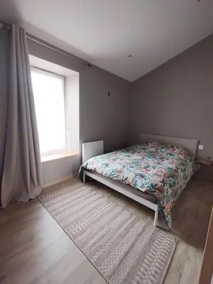 Un ou plusieurs lits dans un hébergement de l'établissement Maison typique rénovée, calme et centrale