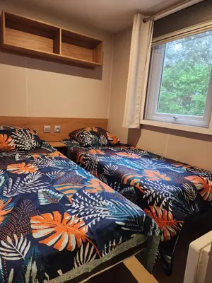 Un ou plusieurs lits dans un hébergement de l'établissement Sejour au Bois Dormant 88