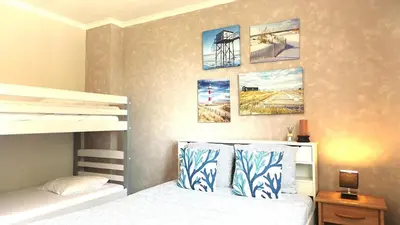 Un ou plusieurs lits dans un hébergement de l'établissement Pêcherie, Grande maison familiale en bord de mer