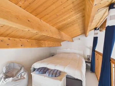 Un ou plusieurs lits dans un hébergement de l'établissement Maison pour 6 avec jardin, centre Noirmoutier