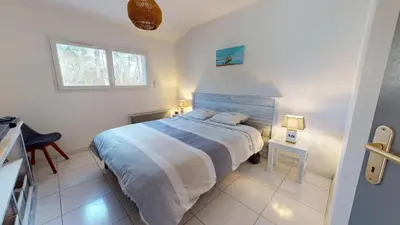 Un ou plusieurs lits dans un hébergement de l'établissement La Villa du Rocher Vert
