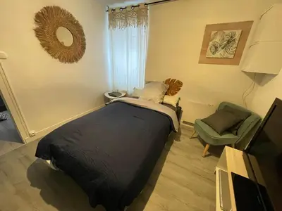 Un ou plusieurs lits dans un hébergement de l'établissement Maison une chambre