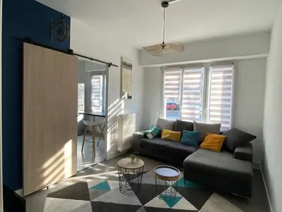 Coin salon dans l'établissement Appartement T4 - 3 chambres