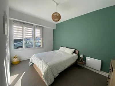 Un ou plusieurs lits dans un hébergement de l'établissement Appartement T4 - 3 chambres