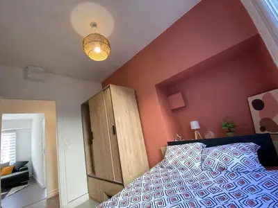Un ou plusieurs lits dans un hébergement de l'établissement Appartement T4 - 3 chambres