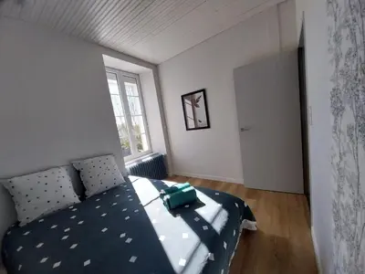 Un ou plusieurs lits dans un hébergement de l'établissement Chez Lilian & Isa - Gîte 6 - 8 personnes