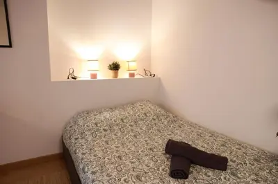 Un ou plusieurs lits dans un hébergement de l'établissement Les Écuries - Studio Hyper Centre & Bouffay