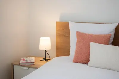 Un ou plusieurs lits dans un hébergement de l'établissement Cozy Apartment Nantes Polyclinic Zenith