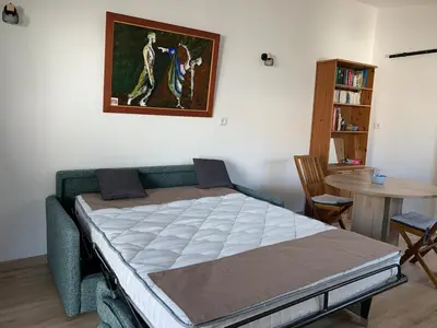 Un ou plusieurs lits dans un hébergement de l'établissement studio cosy proche de l ocean