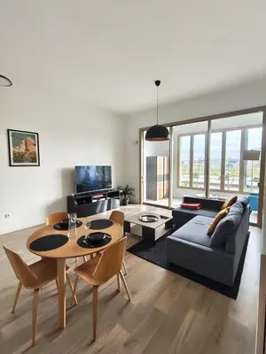 Coin salon dans l'établissement Superbe appartement aux machines de l'île