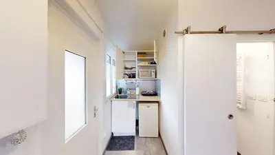 Cuisine ou kitchenette dans l'établissement Lovely studio near Nantes city center