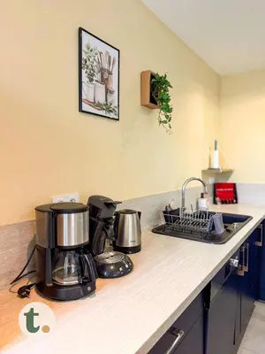 Cuisine ou kitchenette dans l'établissement Tranquiloue - Suite Familiale - 10min Puy du Fou