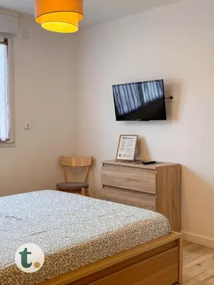 Un ou plusieurs lits dans un hébergement de l'établissement Tranquiloue - Suite Familiale - 10min Puy du Fou