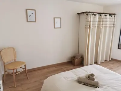 Un ou plusieurs lits dans un hébergement de l'établissement Les Cotonniers, duplex cosy