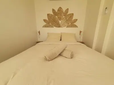 Un ou plusieurs lits dans un hébergement de l'établissement Le Carré Douillet, Appartement lumineux