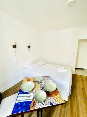 Un ou plusieurs lits dans un hébergement de l'établissement Apparthotel Beauregard 12 cœur de Nantes WIFI