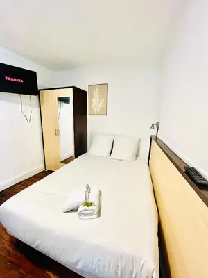 Un ou plusieurs lits dans un hébergement de l'établissement Apparthotel Beauregard 11 cœur de Nantes WIFI