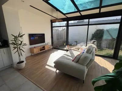 Télévision ou salle de divertissement dans l'établissement Maison 2 chambres