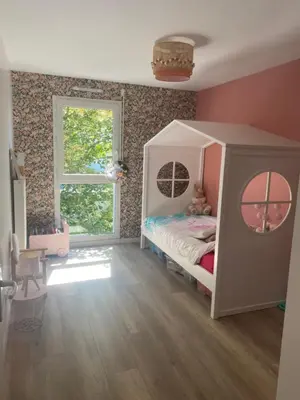 Un ou plusieurs lits dans un hébergement de l'établissement Maison 2 chambres