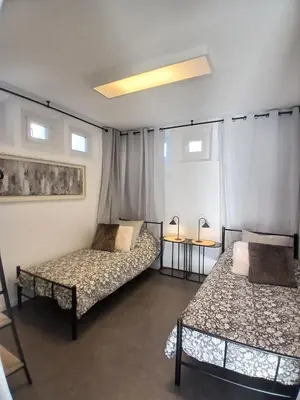 Un ou plusieurs lits dans un hébergement de l'établissement Appartement Vivre un moment face au château
