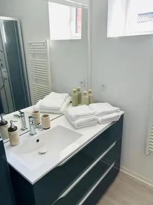 Un ou plusieurs lits dans un hébergement de l'établissement Appartement cosy