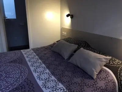 Un ou plusieurs lits dans un hébergement de l'établissement mobilhome tout confort