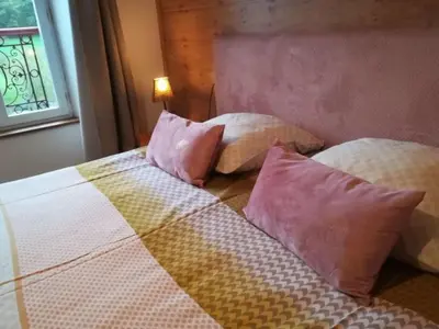 Un ou plusieurs lits dans un hébergement de l'établissement Moulin Pont Vieux Chambres d'hôtes