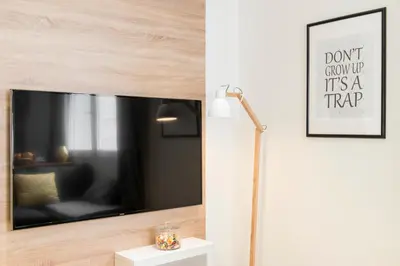 Télévision ou salle de divertissement dans l'établissement Unsejouranantes - Le Magellan