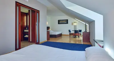 Un ou plusieurs lits dans un hébergement de l'établissement Le Mauritia Hotel et Spa