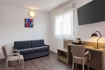 Coin salon dans l'établissement Best Western Hotel Atlantys Zenith Nantes
