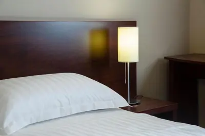 Un ou plusieurs lits dans un hébergement de l'établissement Park Hôtel & Appartements