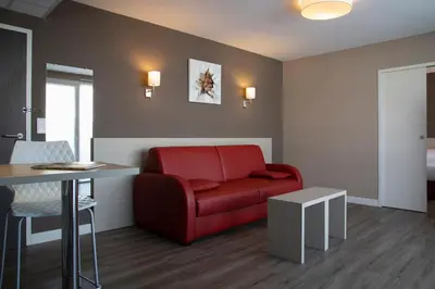 Coin salon dans l'établissement Park Hôtel & Appartements