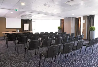 Espace de conférence ou salle de réunion dans l'établissement Park Hôtel & Appartements