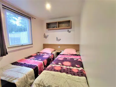 Un ou plusieurs lits dans un hébergement de l'établissement Mobil-homes proche de l'océan