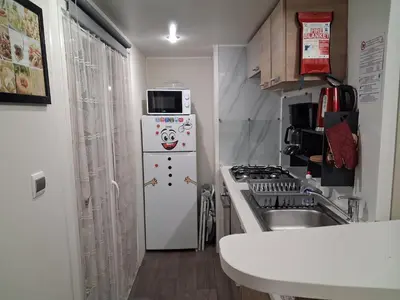 Cuisine ou kitchenette dans l'établissement Mobil-homes proche de l'océan