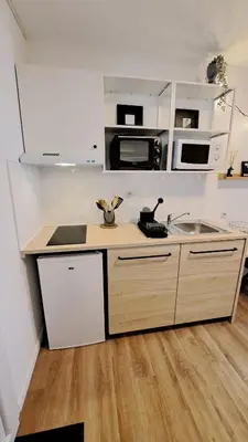 Cuisine ou kitchenette dans l'établissement Studio du 104
